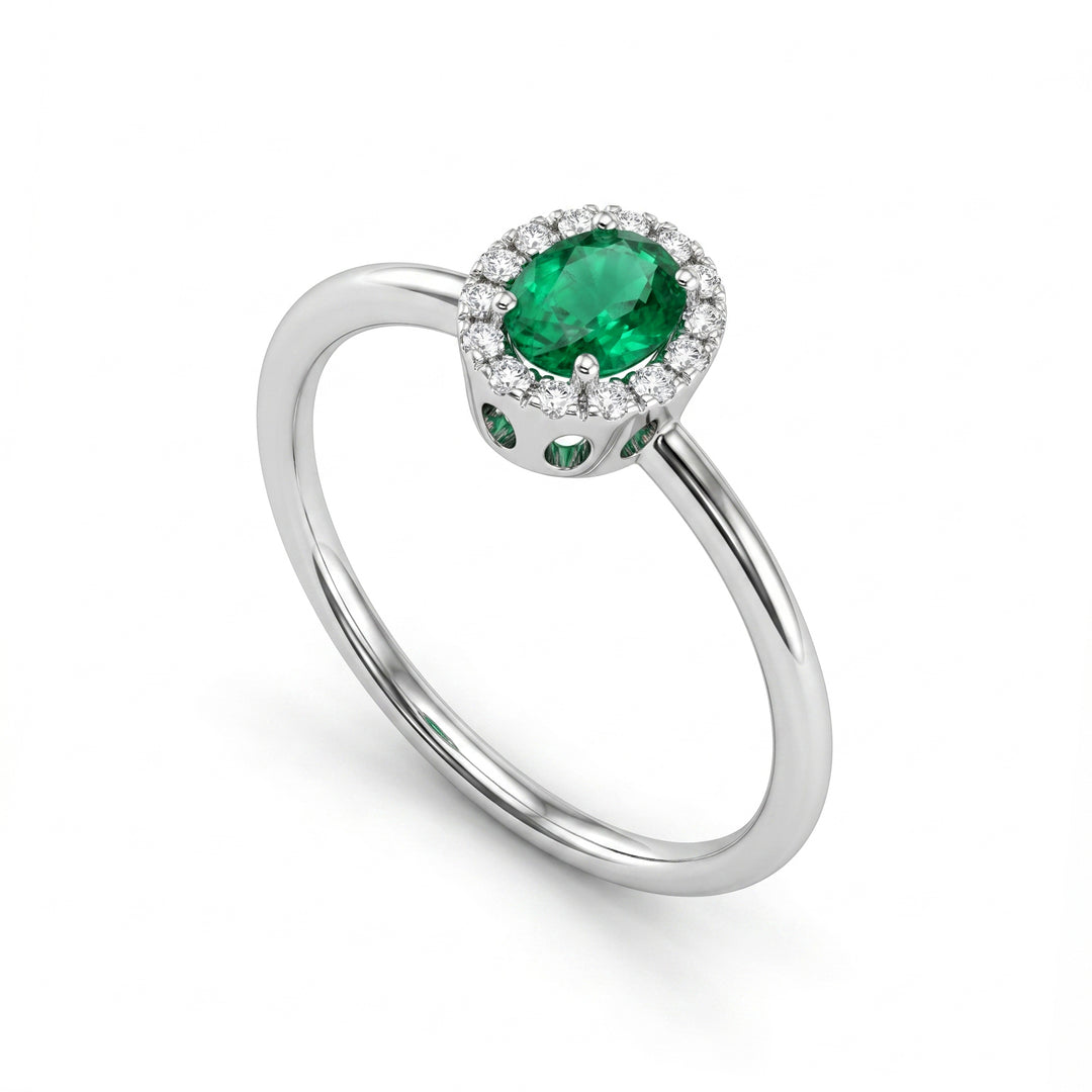 Mikiko an 18k oval emerald 5x4 with diamond outline and smooth shank MA5234O4BE