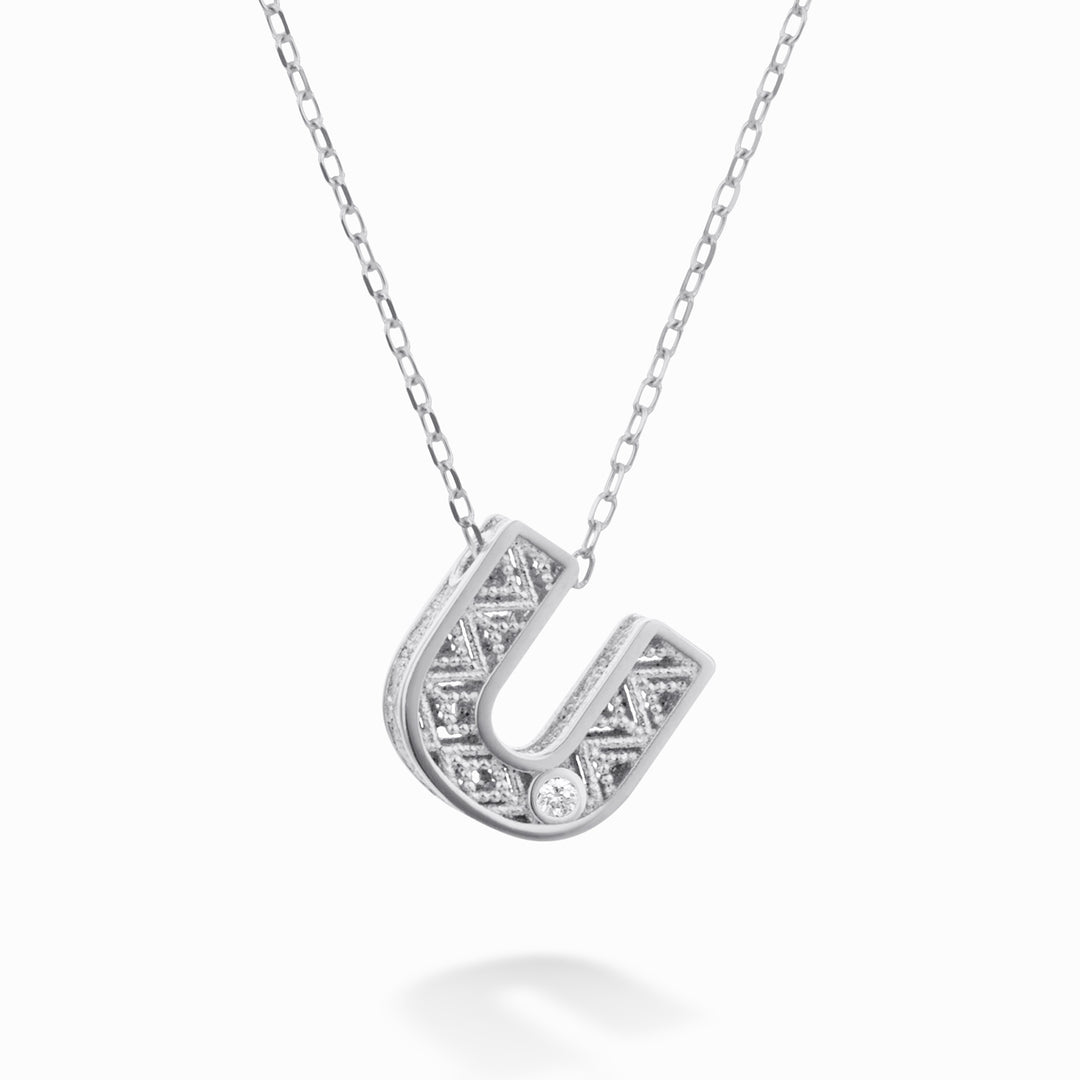 Nihama cl 18k lettre u or blanc diam. ct.0,01 NDLETUO4