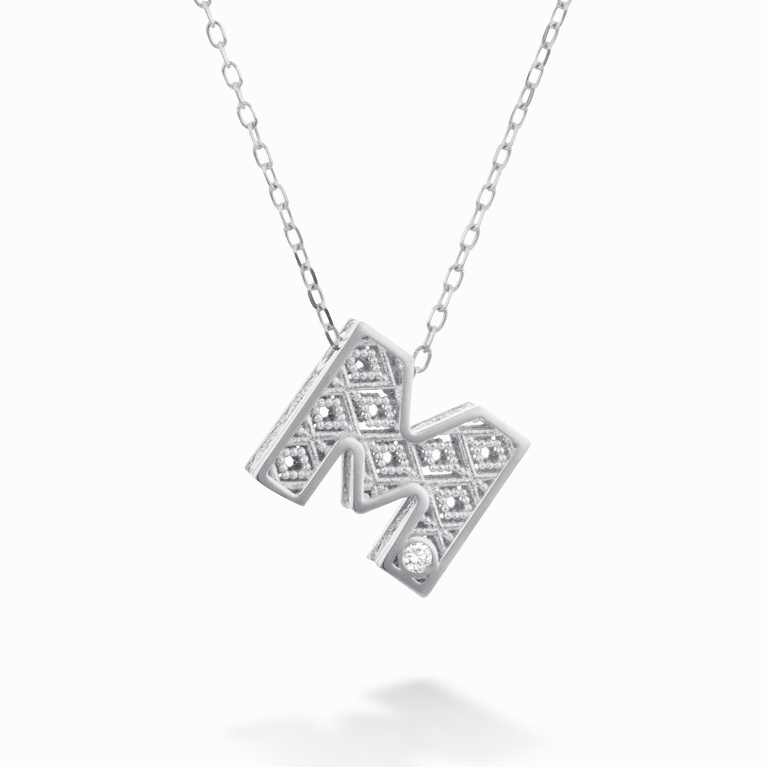 Mikiko cl 18k lettera m oro bianco diam. ct.0,01 MDLETMO4